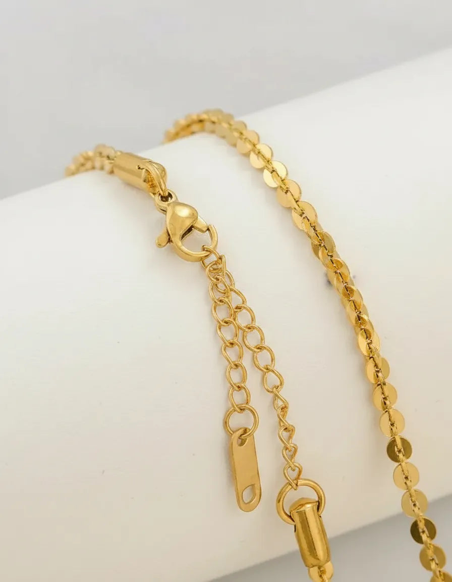 Cadena dorada con discos brillantes C-0034