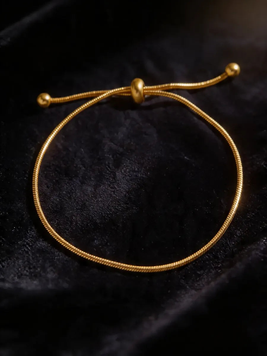 Pulsera ajustable tipo cordón dorado P-0014
