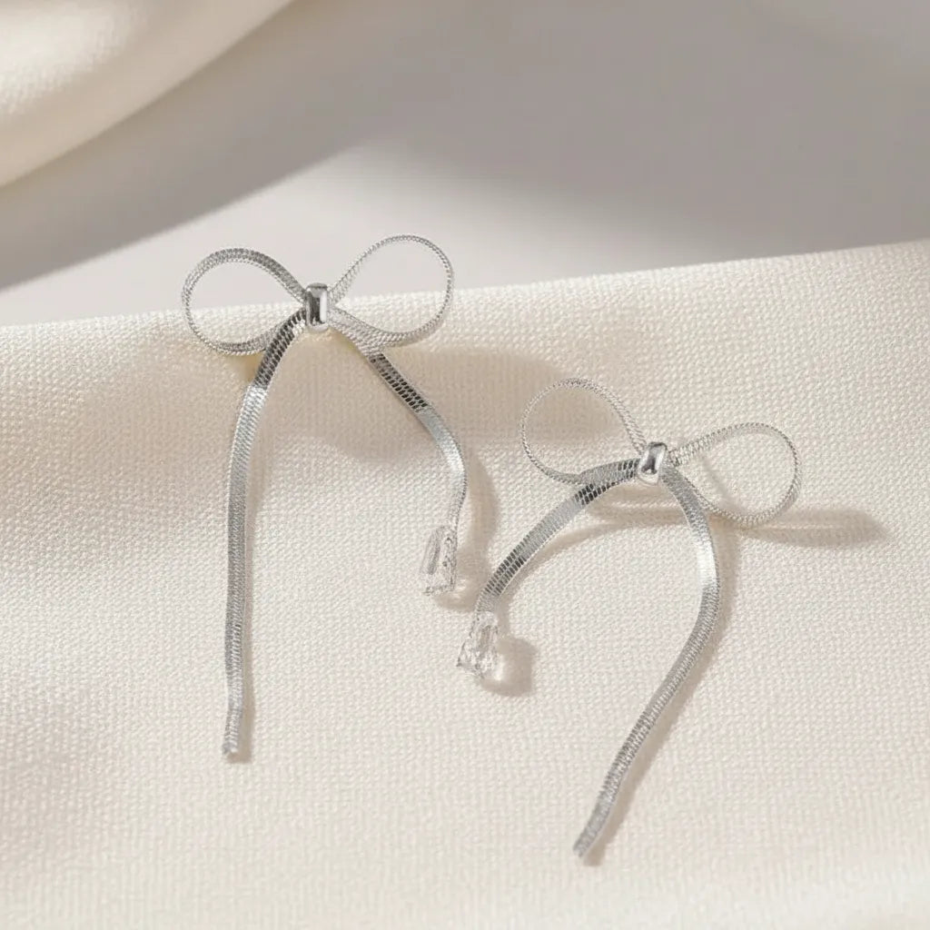 Aretes largos lazo plateado con cadena y caída A-0037