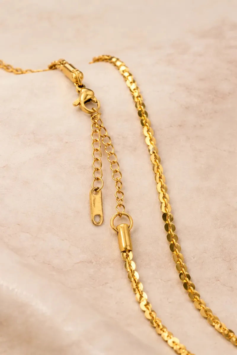 Cadena dorada con discos brillantes C-0034
