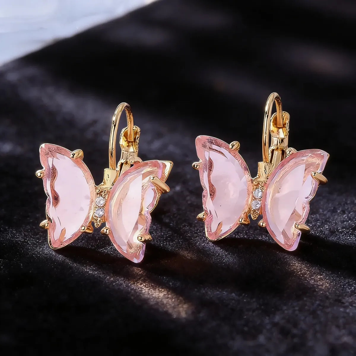 Aretes mariposa rosa con cristal tipo zirconia A-0003