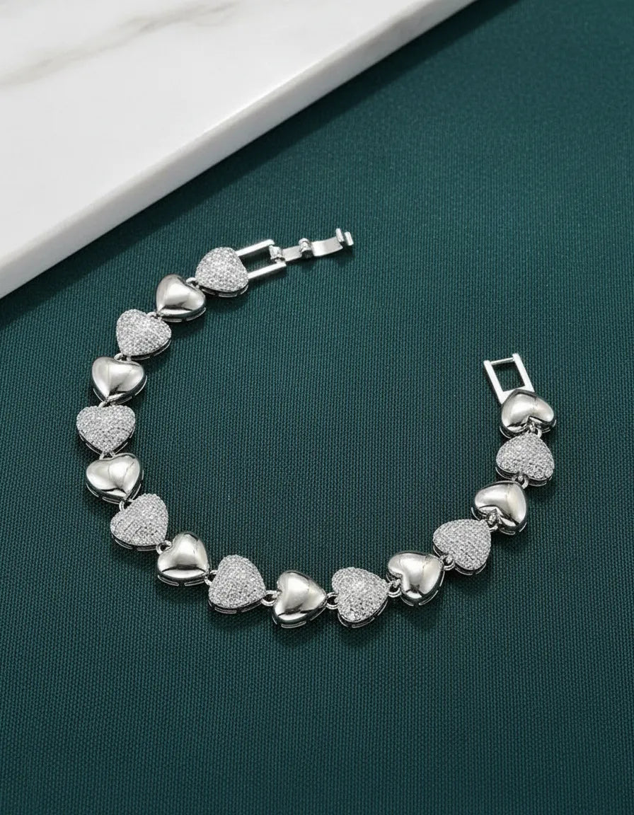 Pulsera plateada de corazones con zirconias P-0003