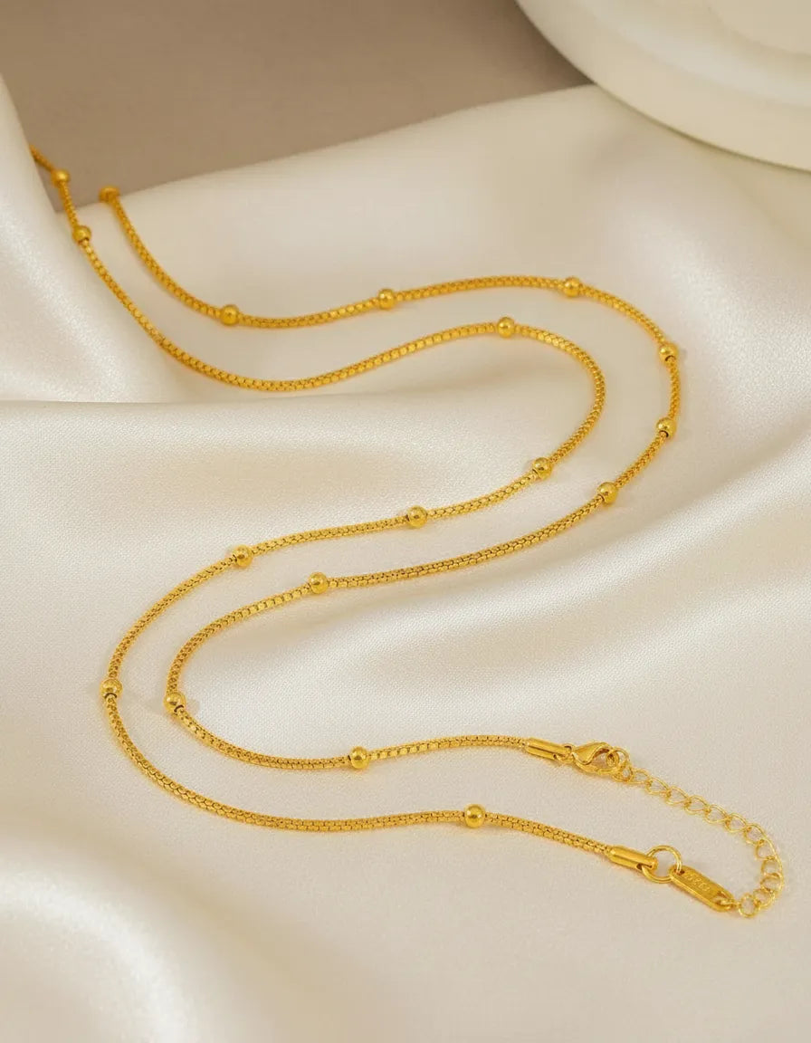 Collar dorado con esferas C-0011