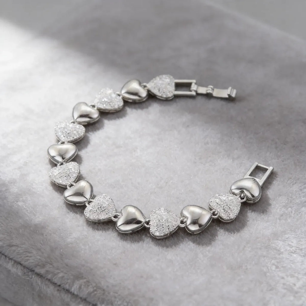 Pulsera plateada de corazones con zirconias P-0003
