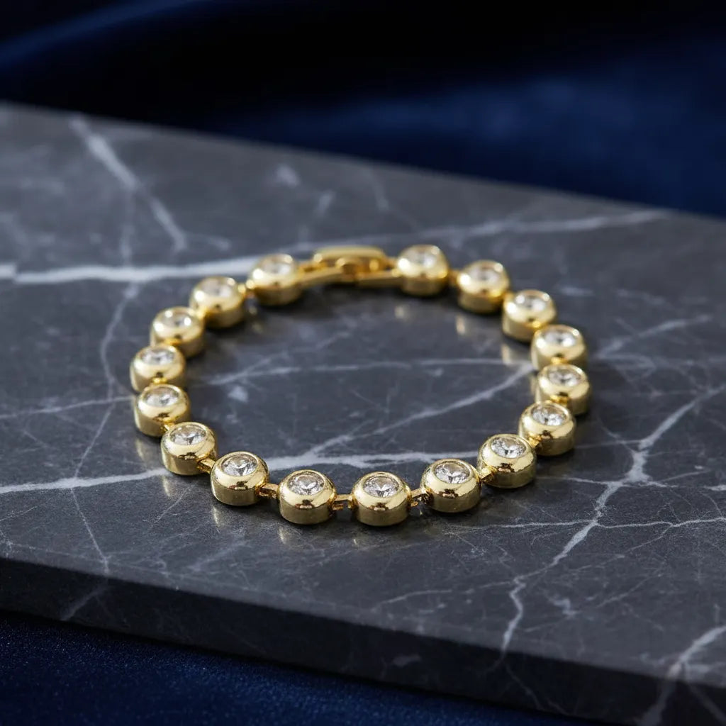 Pulsera dorada tipo tennis con zirconias engastadas P-0019