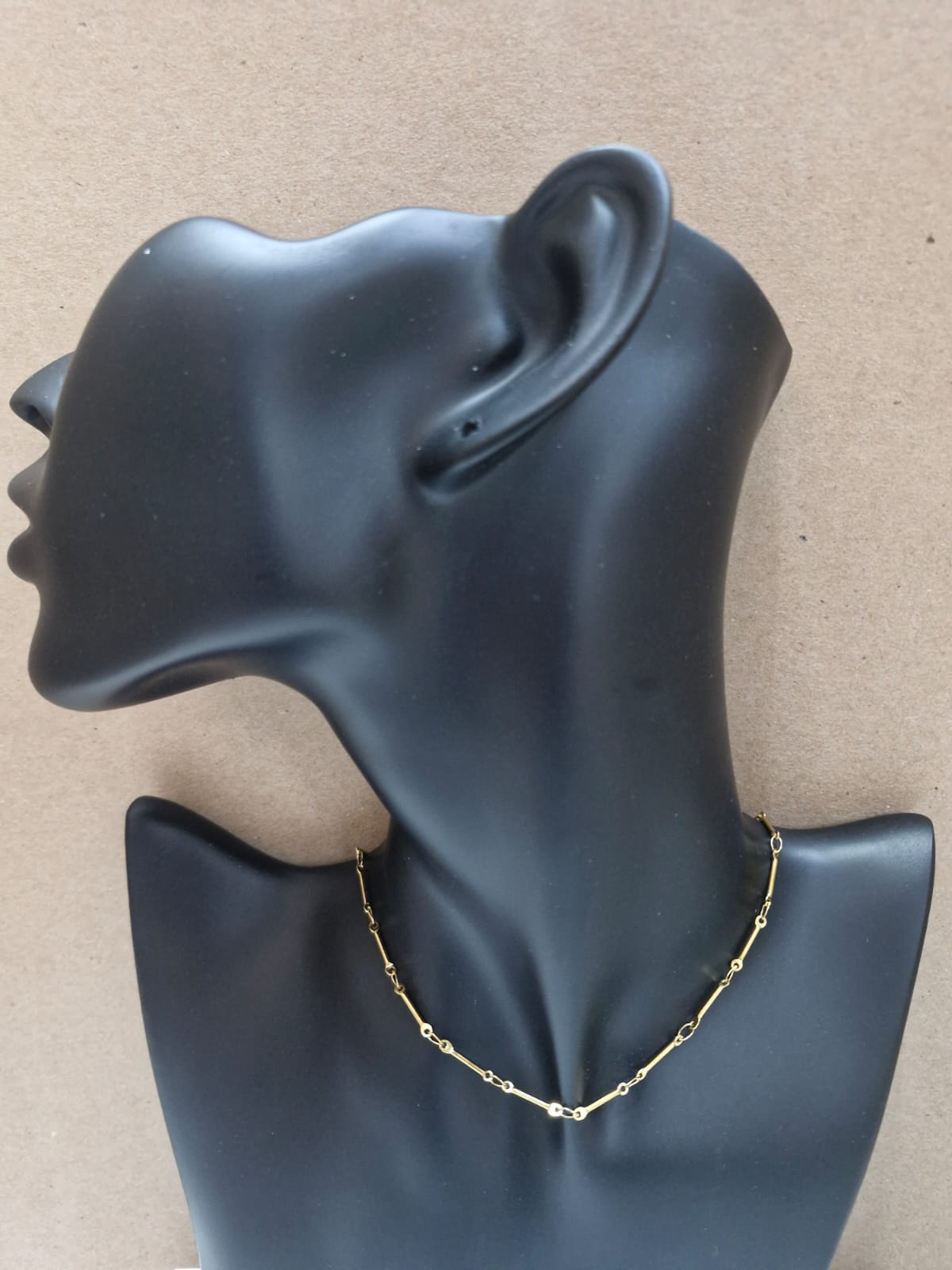 Cadena dorada con barras y detalles brillantes C-0032
