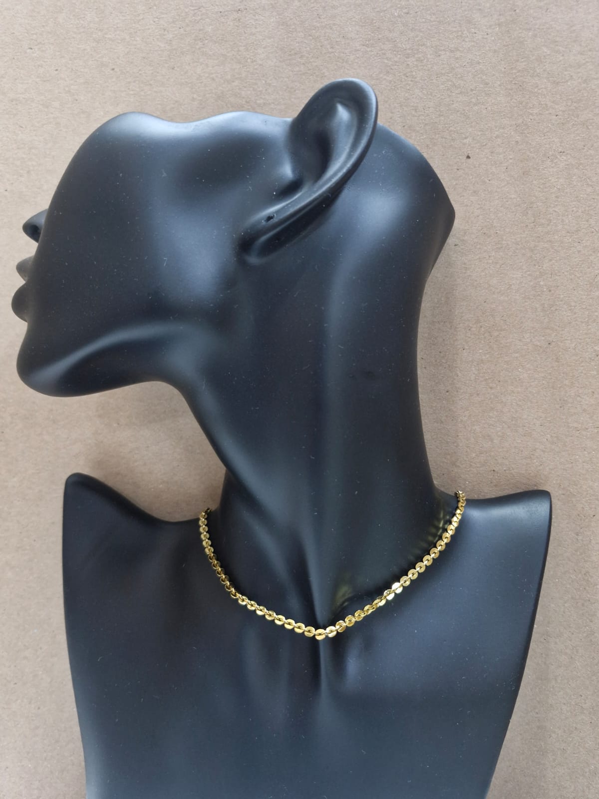 Cadena dorada con discos brillantes C-0034